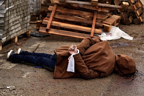 In Ukrainian street, a corpse with hands bound and a bullet wound to the head
