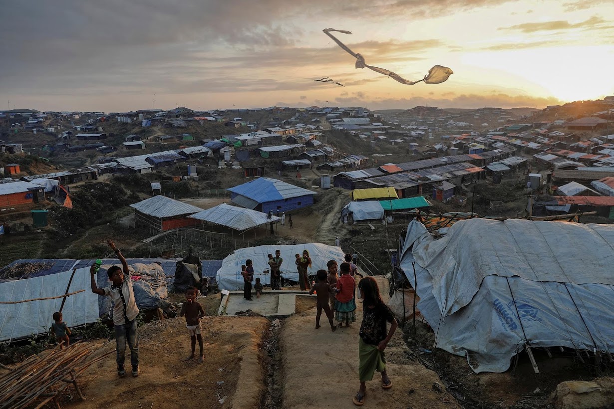Rohingya refugee children fly improvised kites at the Kutupalong refugee camp near Cox's Bazar.